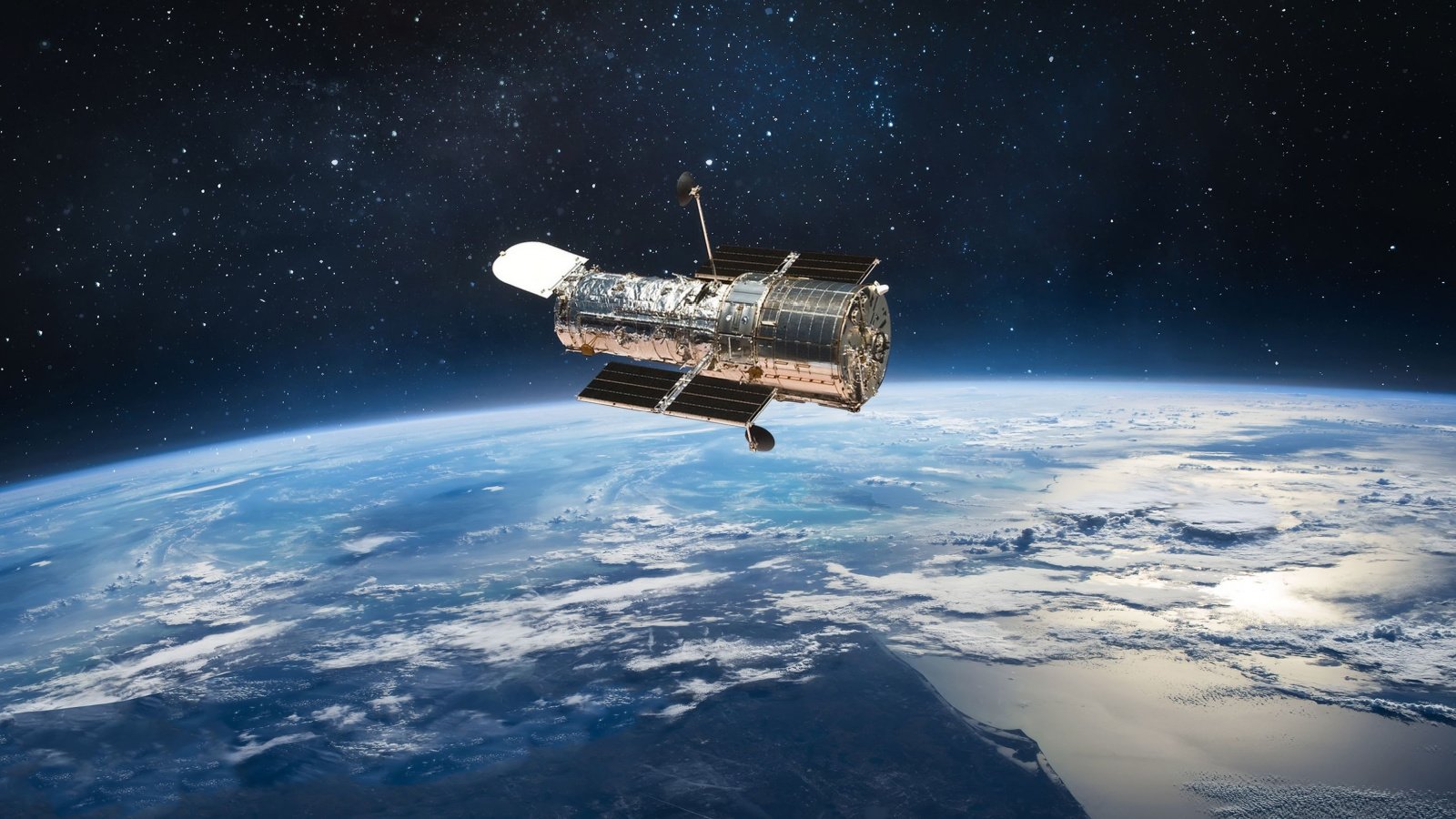 Hubble space telescope on orbit of Earth planet. Space observatory research Dima Zel Shutterstock