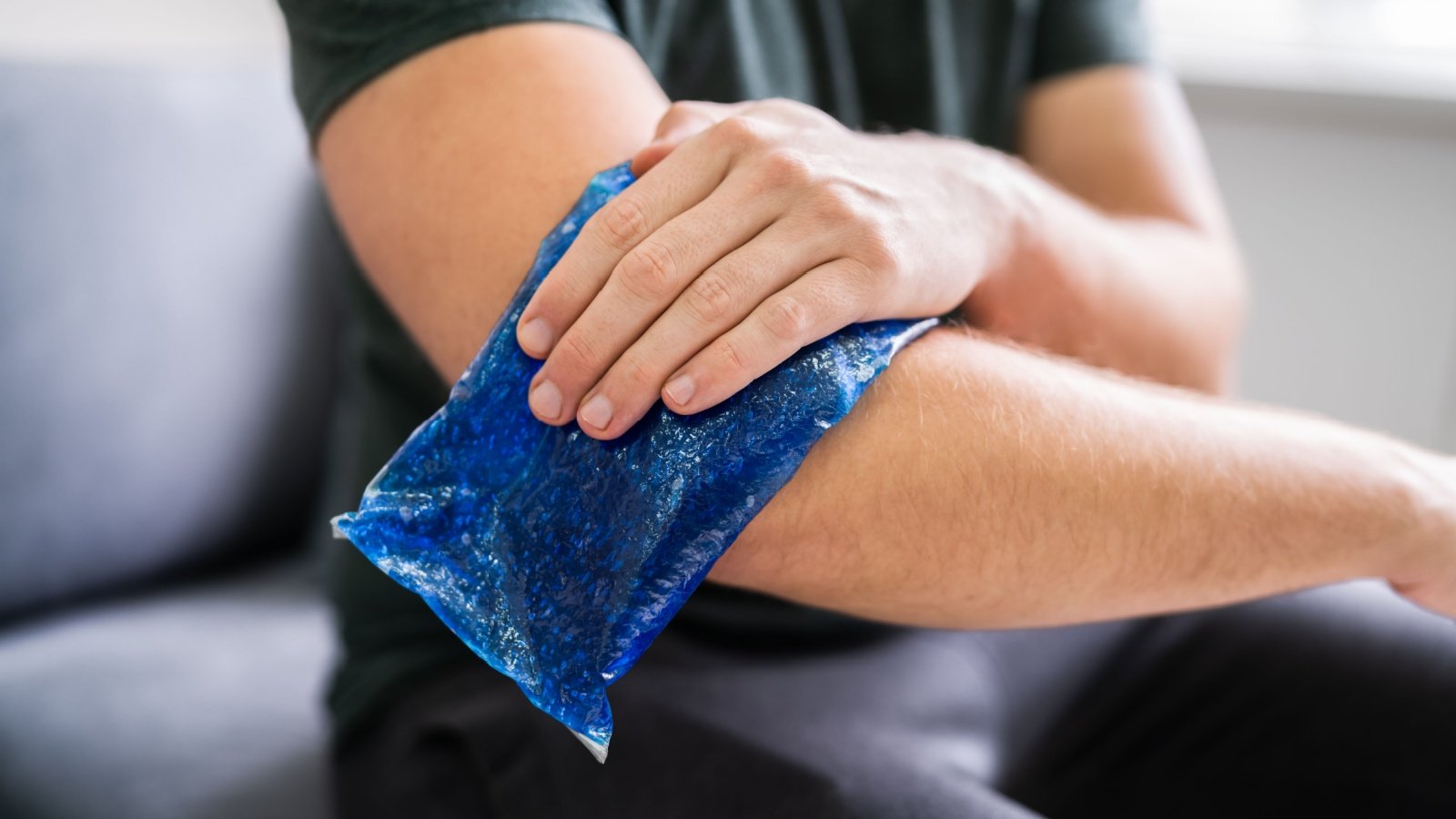 Ice Gel Pack On Injured Arm injury hurt first aid medical burn Andrey Popov Shutterstock