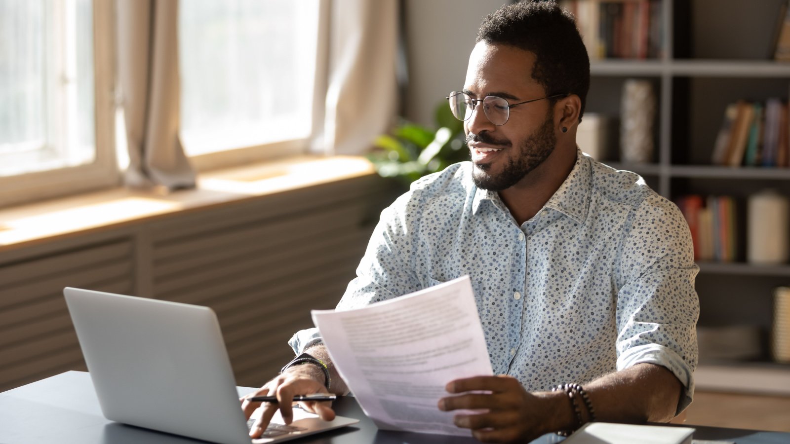 Investor Finance Working from home POC male computer fizkes Shutterstock