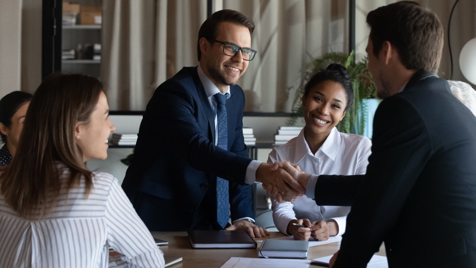 Investors business hand shake meeting finance fizkes Shutterstock