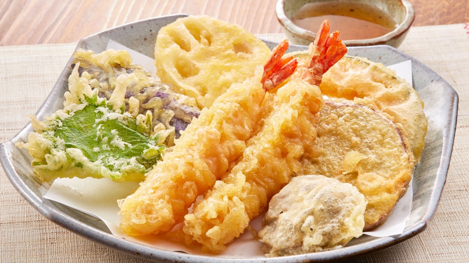 Japanese tempura shrimp and vegetables with sauce funny face Shutterstock