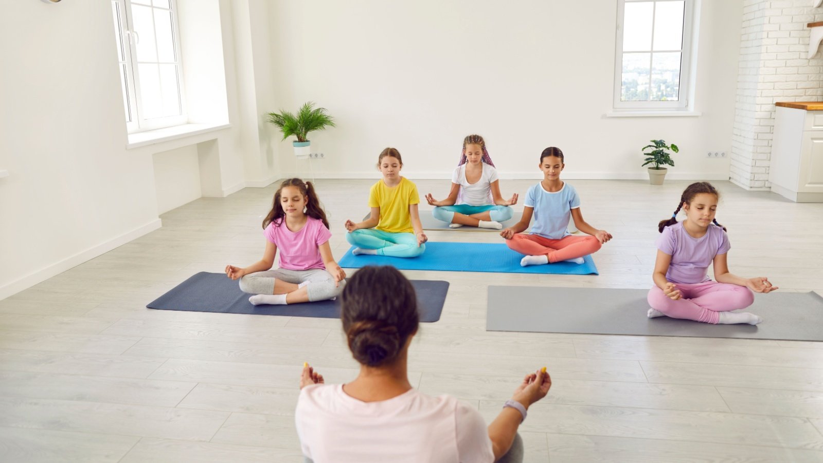 KIds children practice meditation yoga mindfulness Studio Romantic Shutterstock