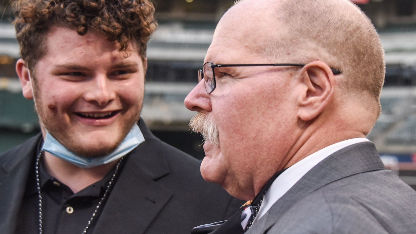 Kansas City Chiefs coach Andy Reid (right) talks to John Madden's grandson Aidan Bob Cullinan Shutterstock