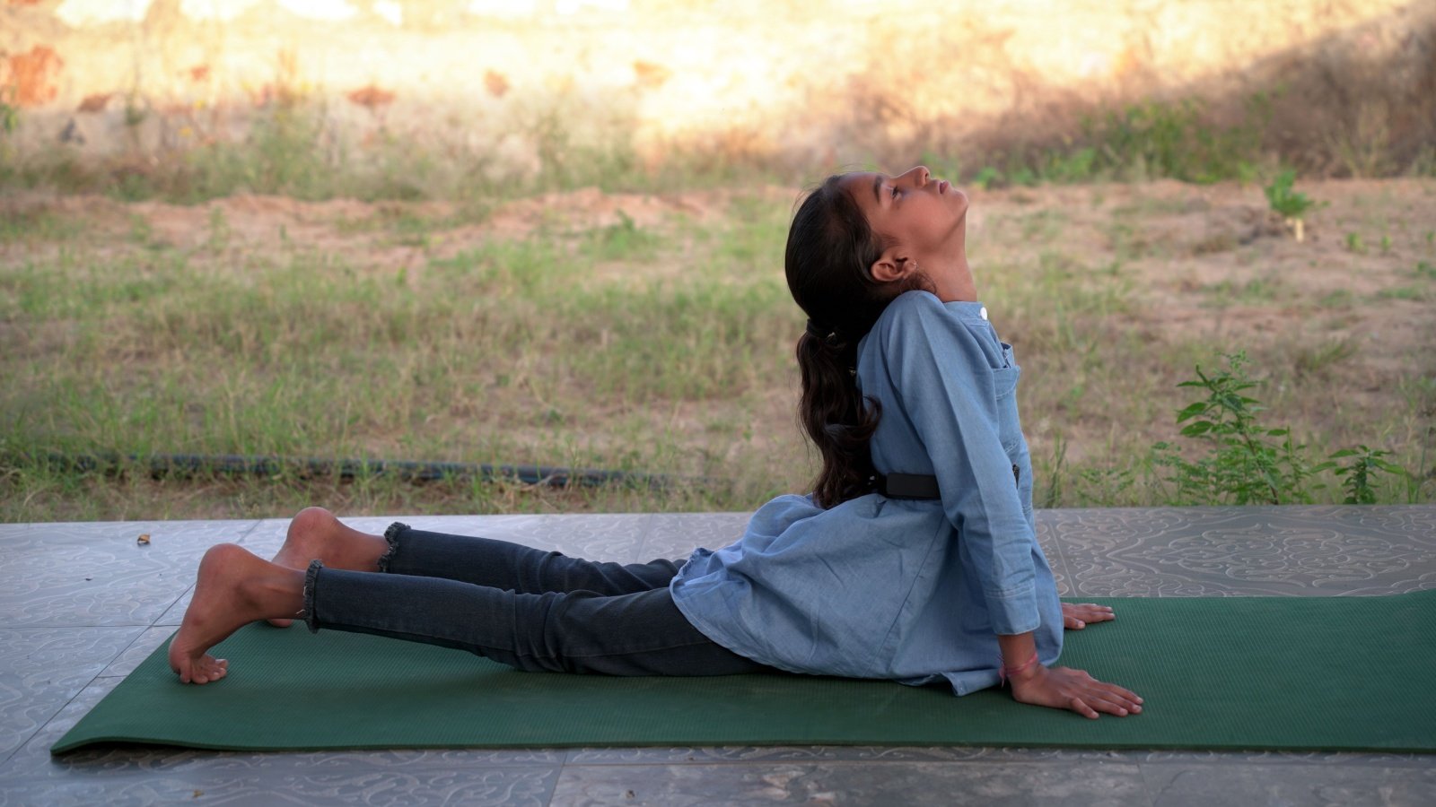 Kid child girl doing yoga meditation mindfulness exercise fitness Govind Jangir Shutterstock