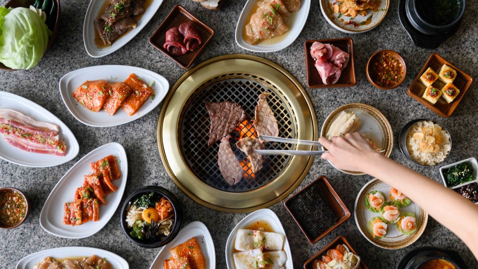 Korean BBQ food with fresh vegetables and meat Phongsak Ketjamrat Shutterstock