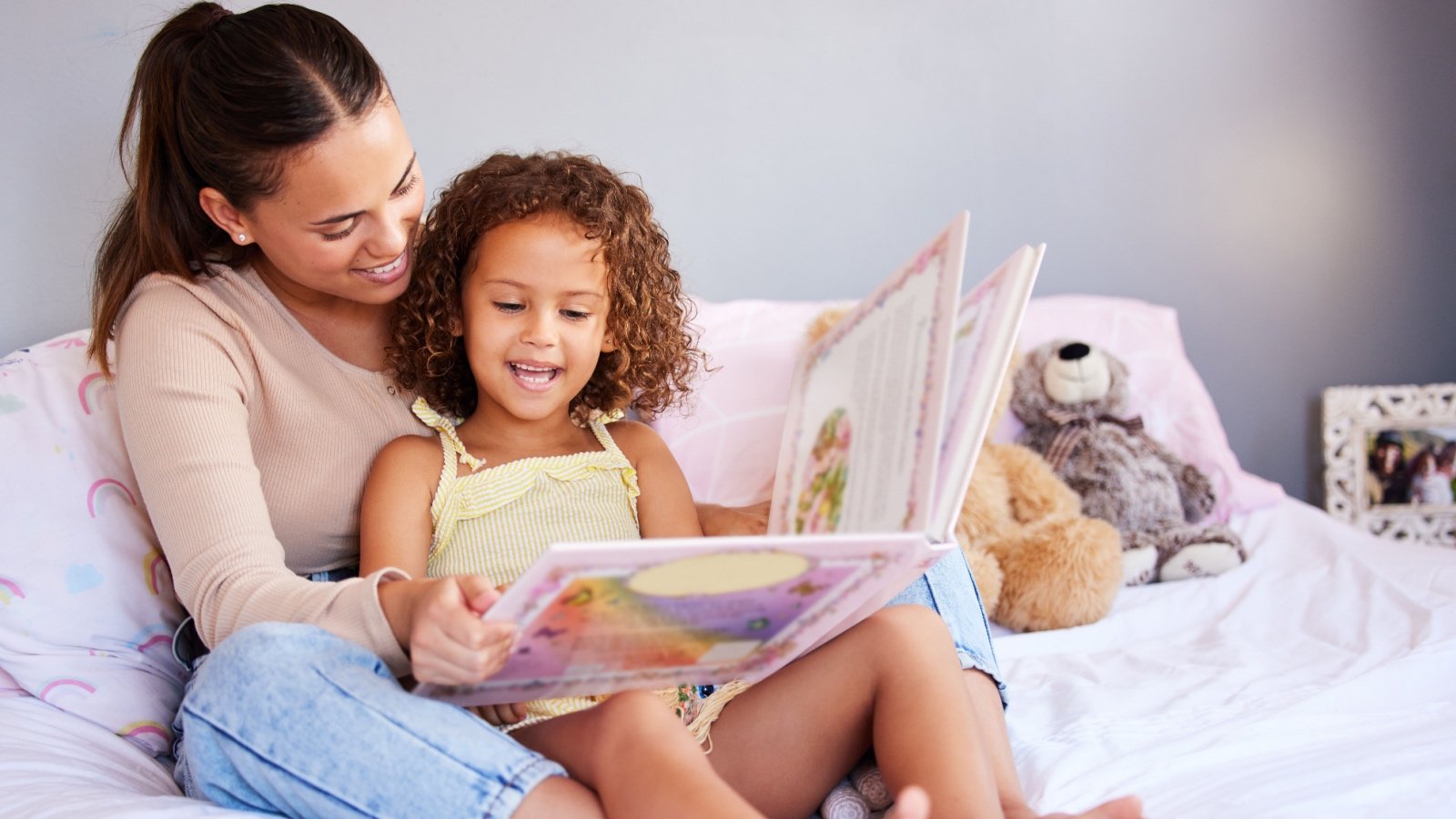 Little girl and mother reading book PeopleImages.com Yuri A Shutterstock