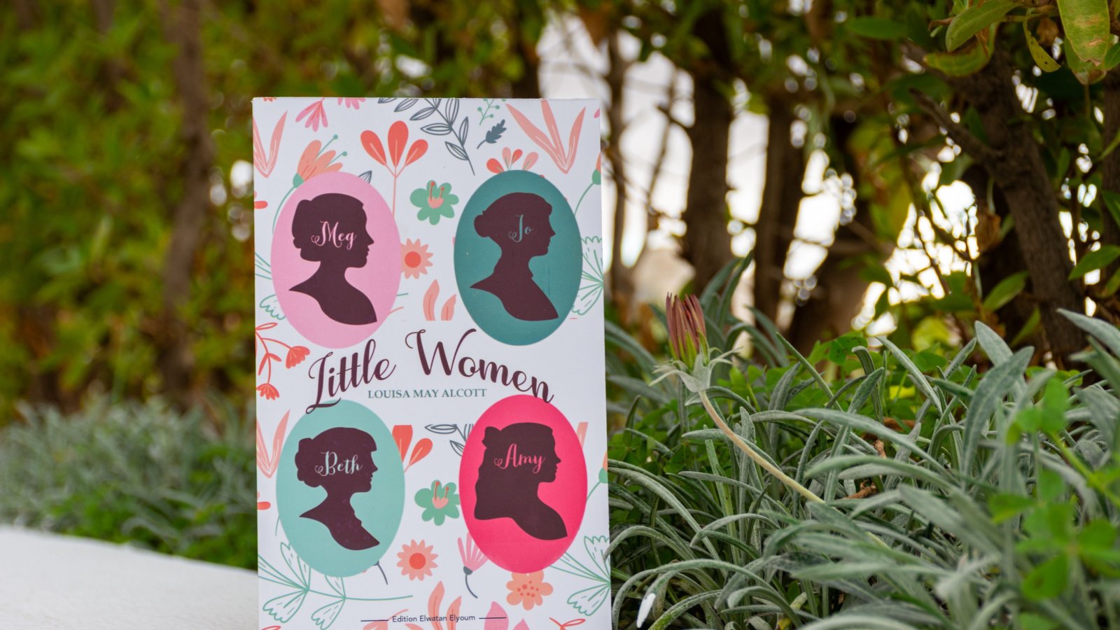 Louisa May Alcott's Little Women Novel in The Garden hamdi bendali shutterstock