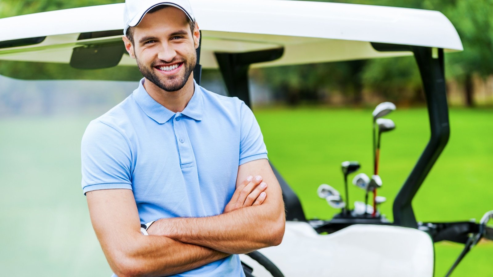 Male Golf Cart Polo Shirt Hat fitness G Stock Studio Shutterstock