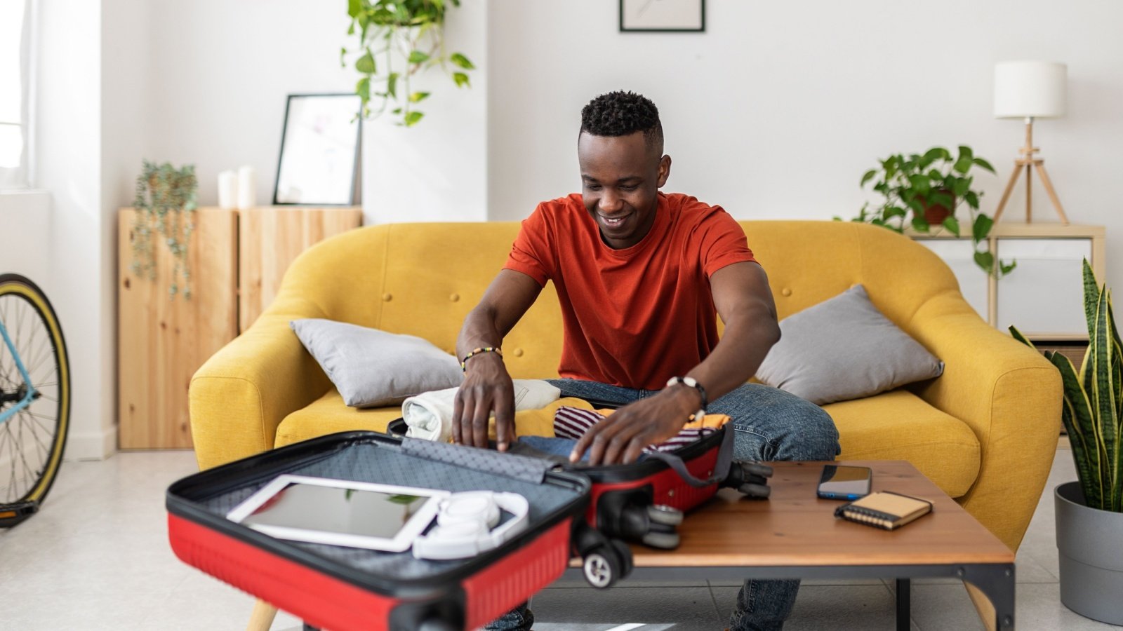 Male Travel Packing Suitcase Rolling Clothes Xavier Lorenzo Shutterstock