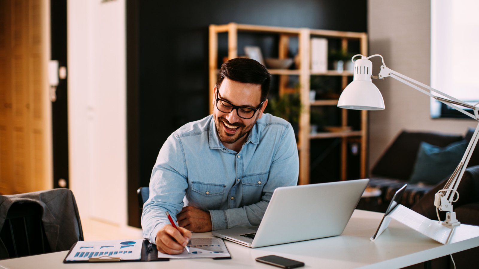 Male Work Computer Finance Smiling djile Shutterstock