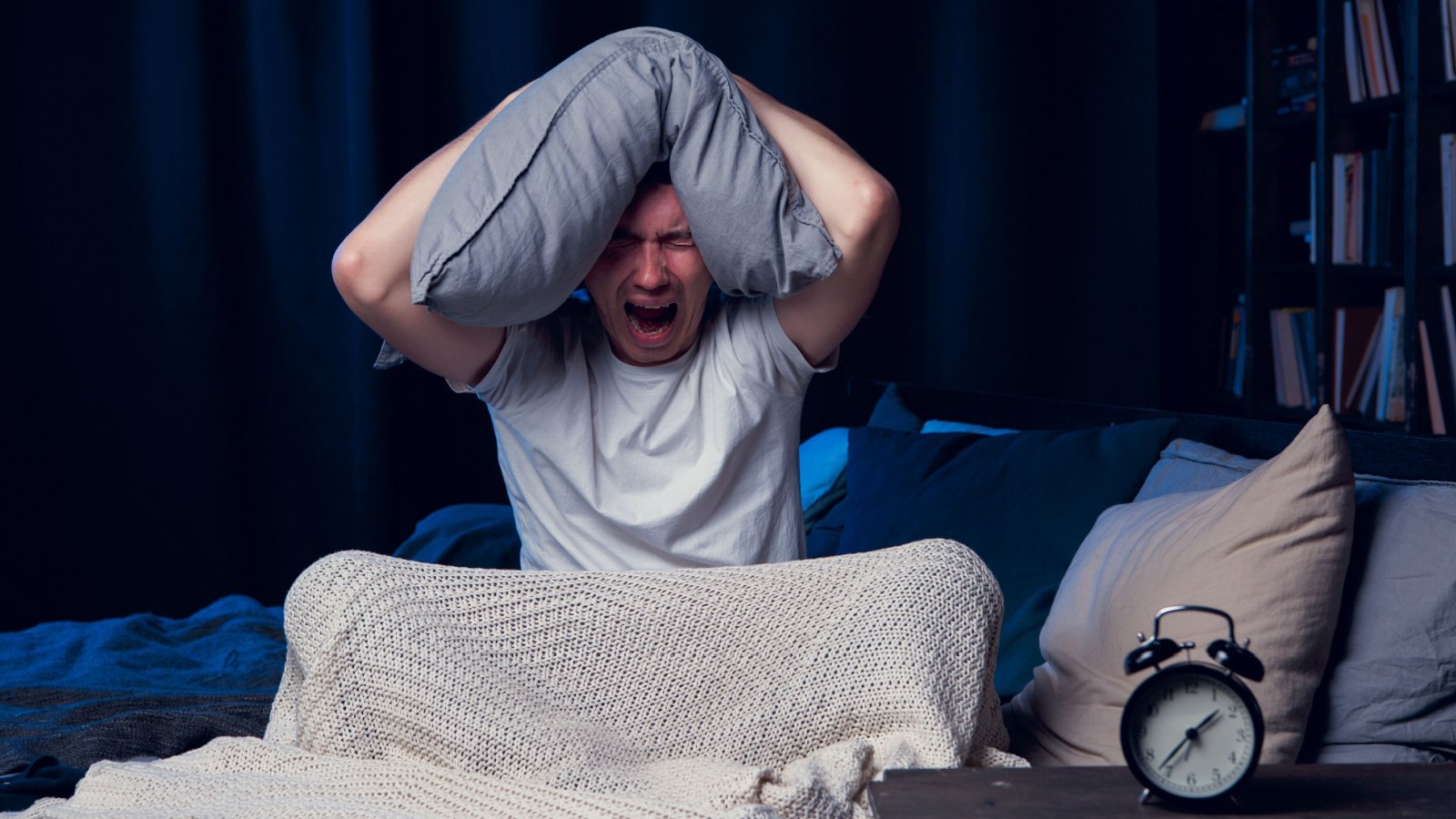 Male alarm clock sleep insomnia angry anxious Sergey Mironov shutterstock