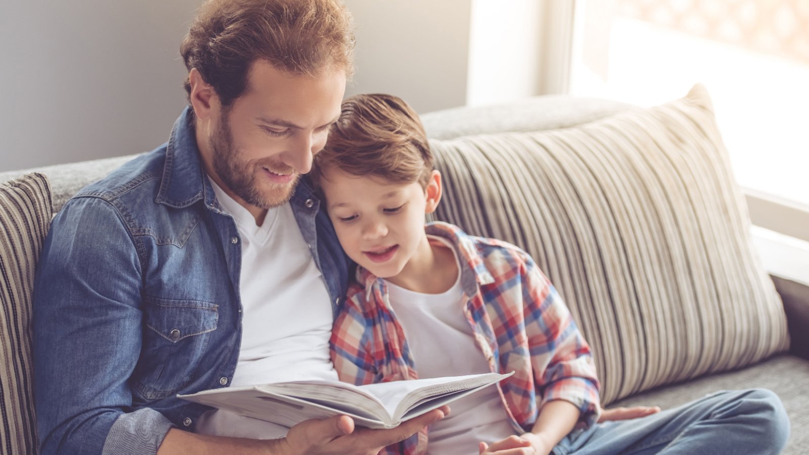 Male father reading child parenting home George Rudy Shutterstock