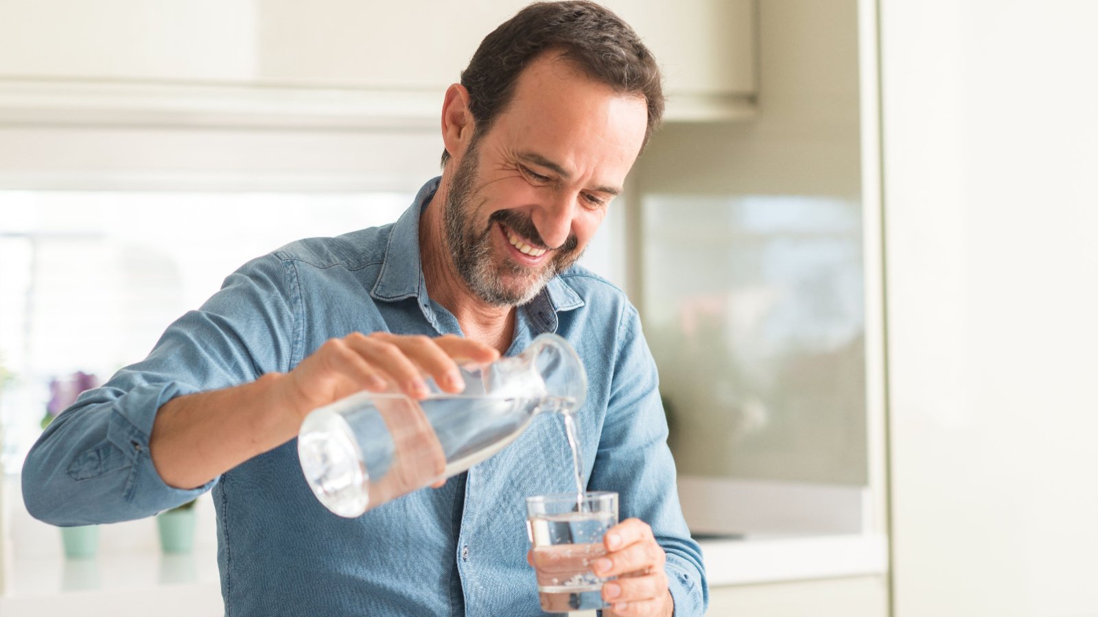 Male middle aged drinking water hydration Shift Drive Shutterstock