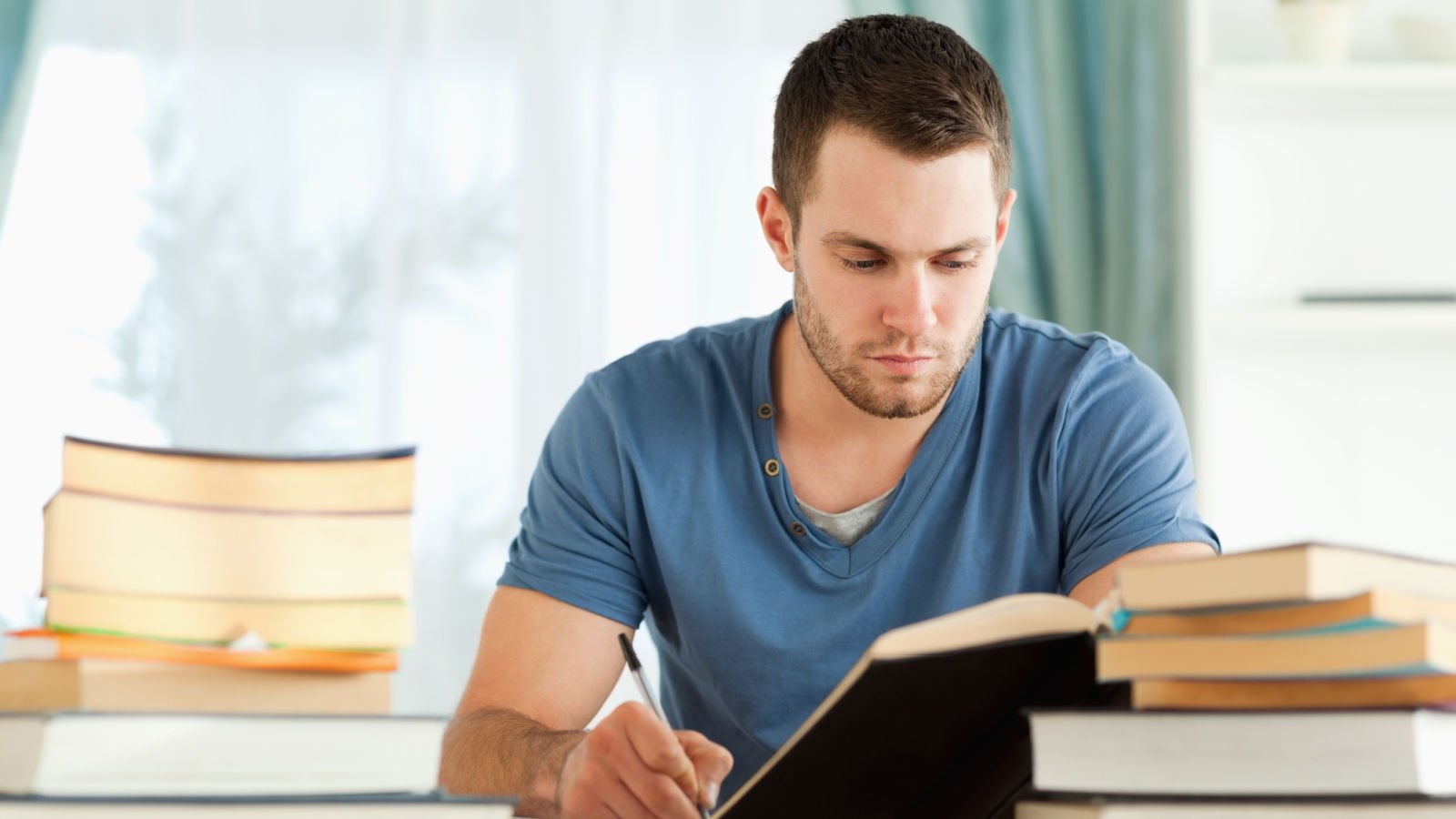 Male student preparing research reading study ESB Professional shutterstock