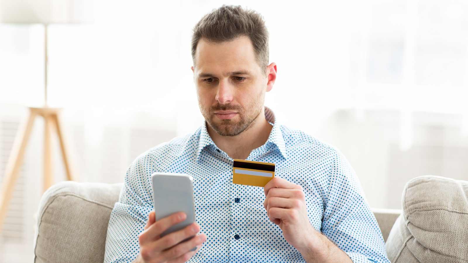 Man with credit card shutterstock MSN