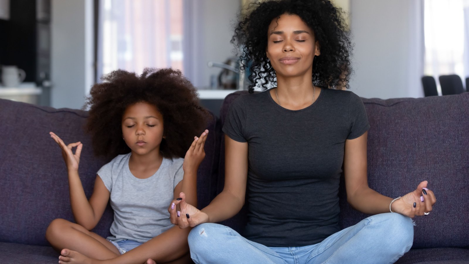 Meditate Yoga Family Mom Mother Daughter fizkes shutterstock