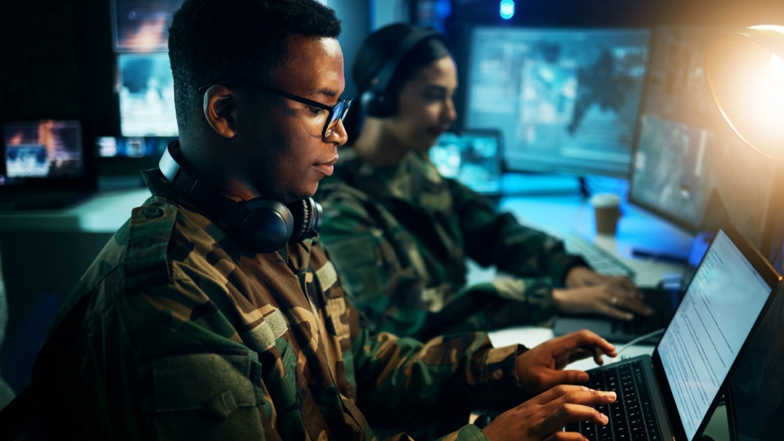 Military control room, computer and soldier at desk PeopleImages.com Yuri A Shutterstock