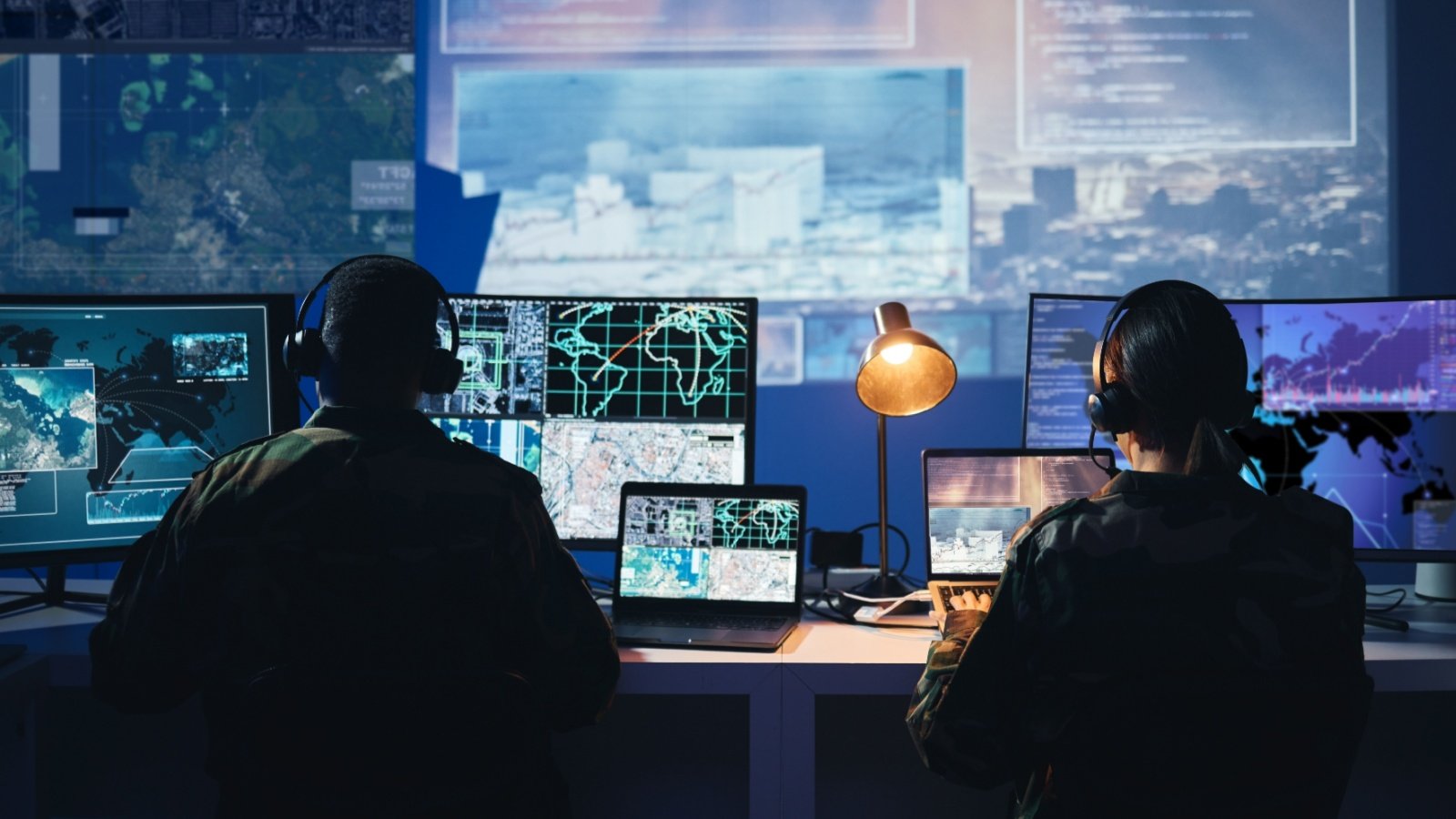 Military control room, computer screen and team with surveillance PeopleImages.com Yuri A Shutterstock