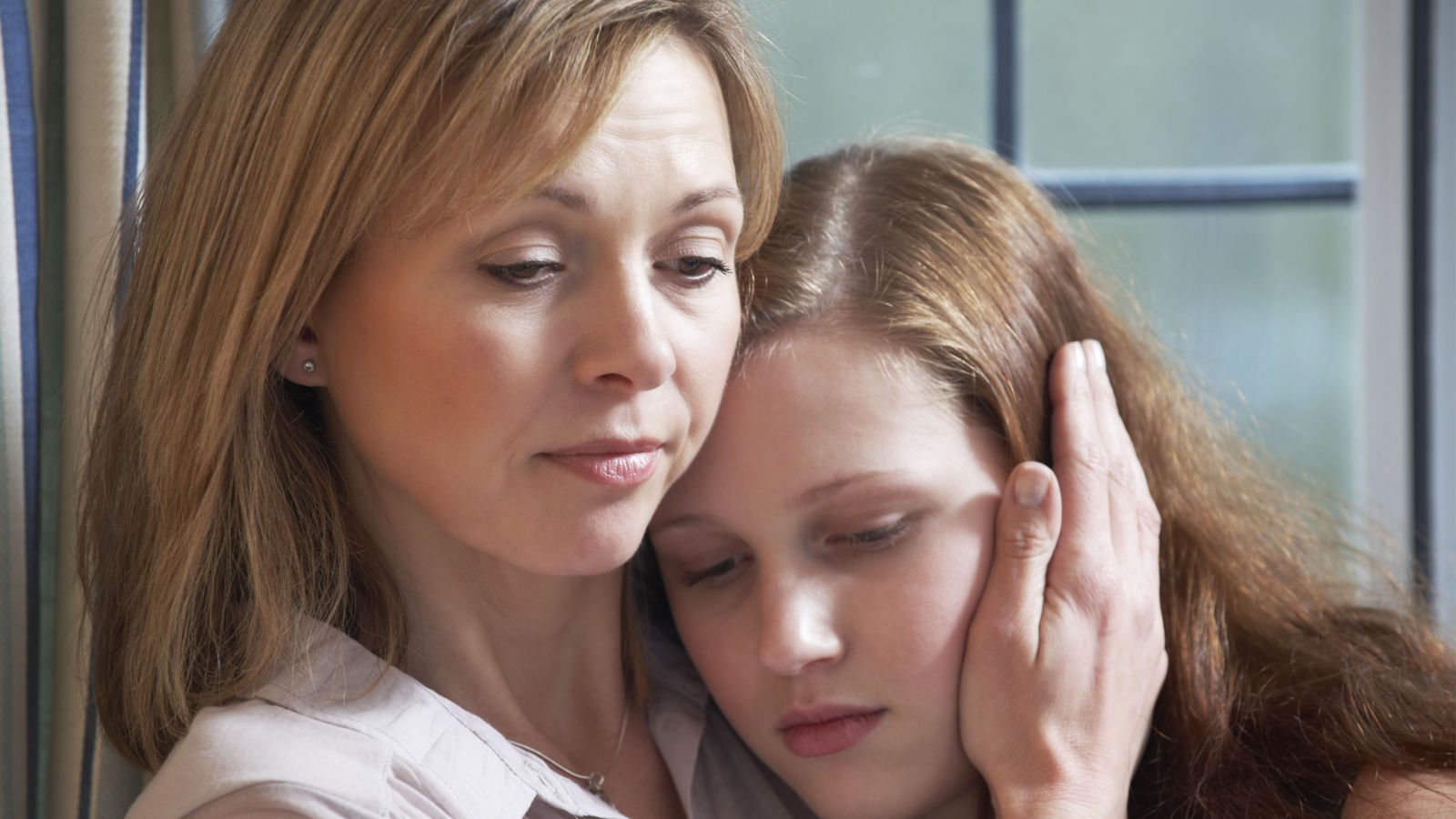 Mother Comforting Teenage Daughter speedkingz shutterstock