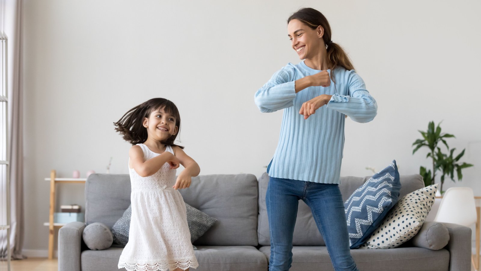 Mother Daughter Dancing Living Room House fizkes shutterstock