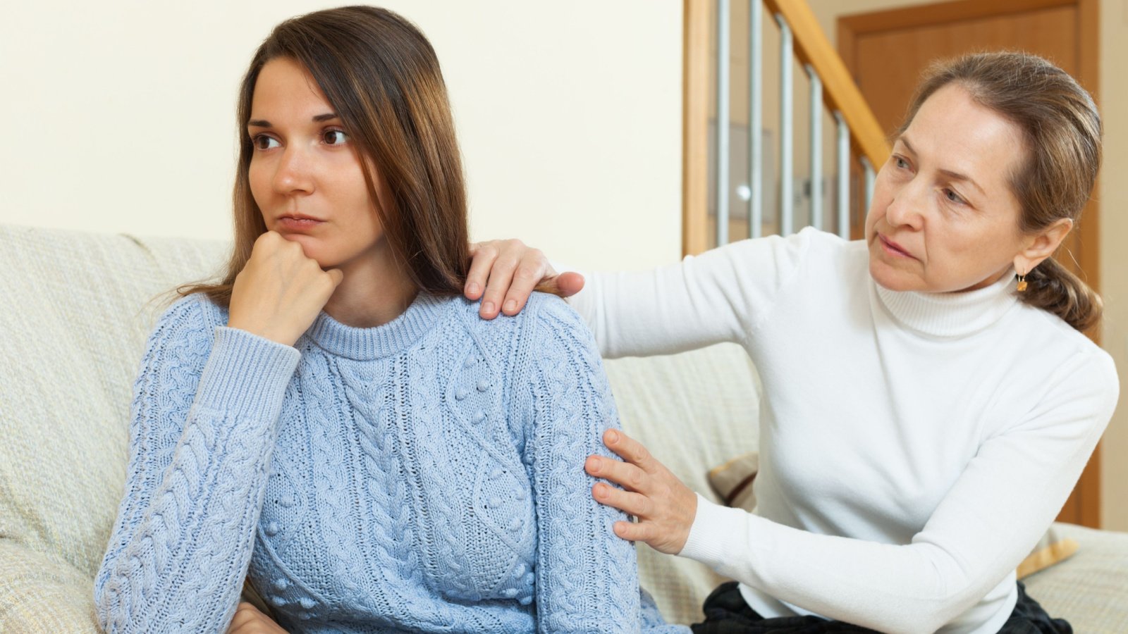 Mother and daughter after quarrel on sofa in home fight bear fotos shutterstock