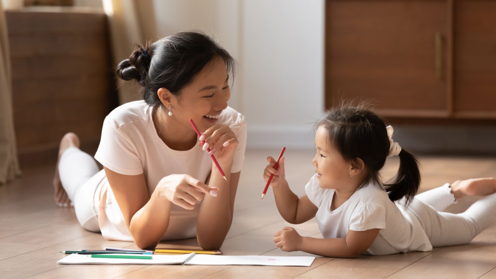 Mother daughter color draw art fizkes shutterstock