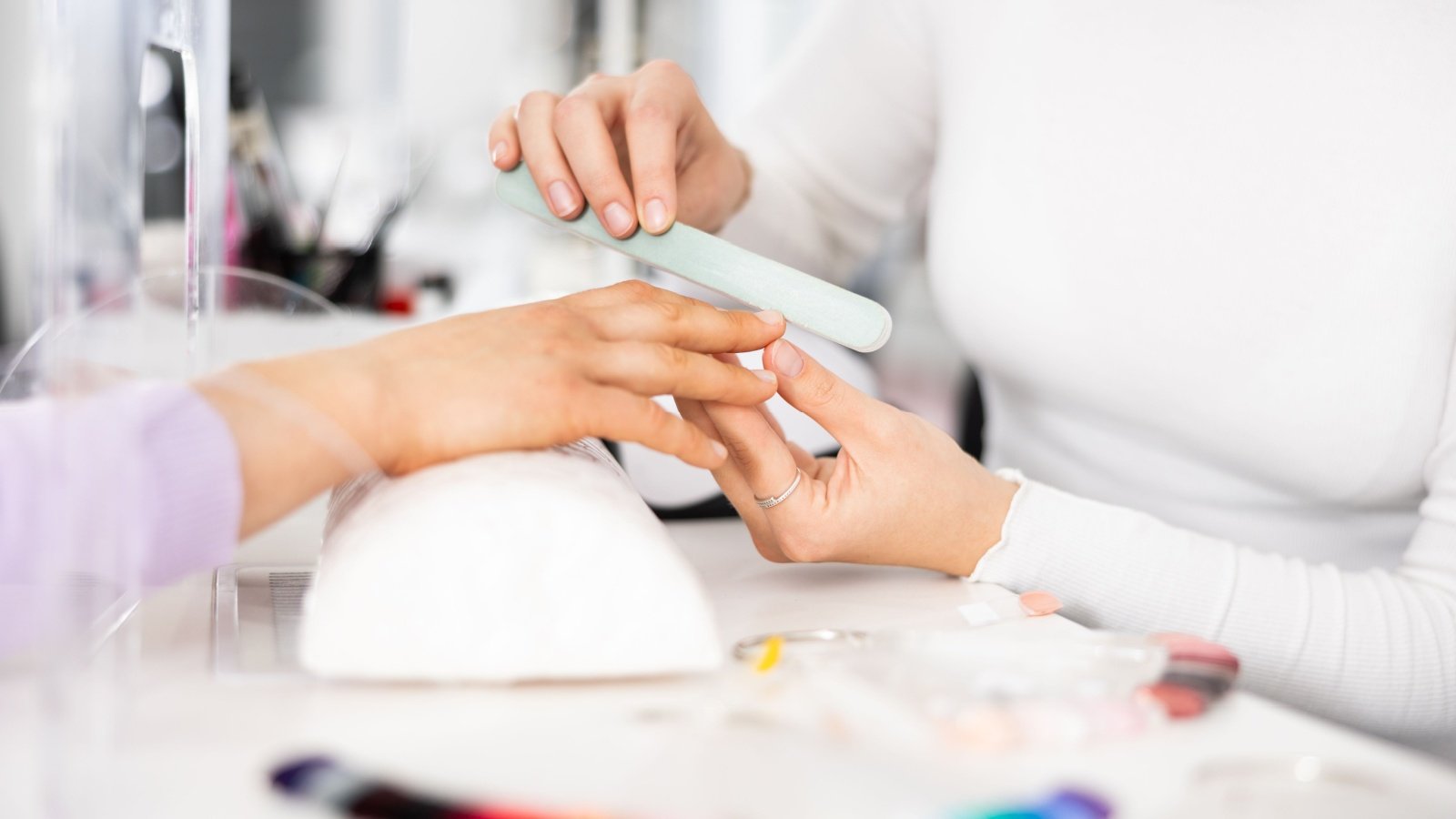 Nail salon manicure hands BearFotos Shutterstock