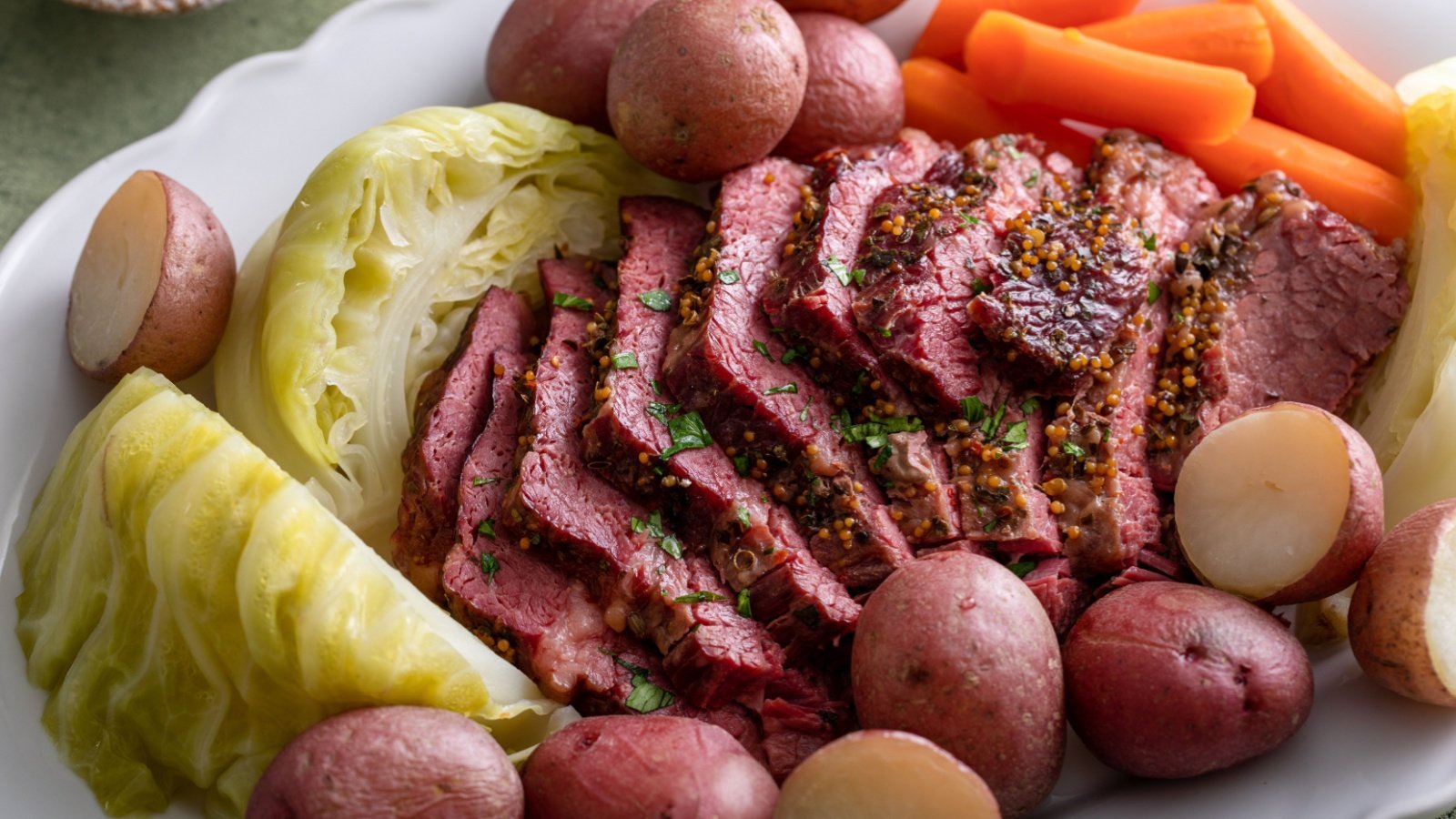 New England Boiled Dinner Corned beef sliced served with cabbage potatoes and carrots Elena Veselova Shutterstock New England Boiled Dinner Corned beef sliced served with cabbage potatoes and carrots Elena Veselova Shutterstock