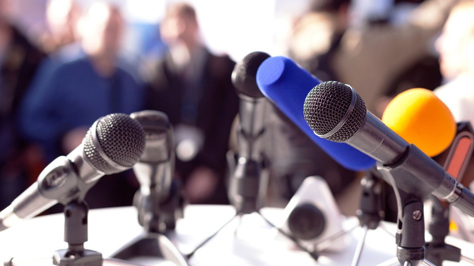 News press conference media announcement microphone reporters journalists speak politics wellphoto Shutterstock