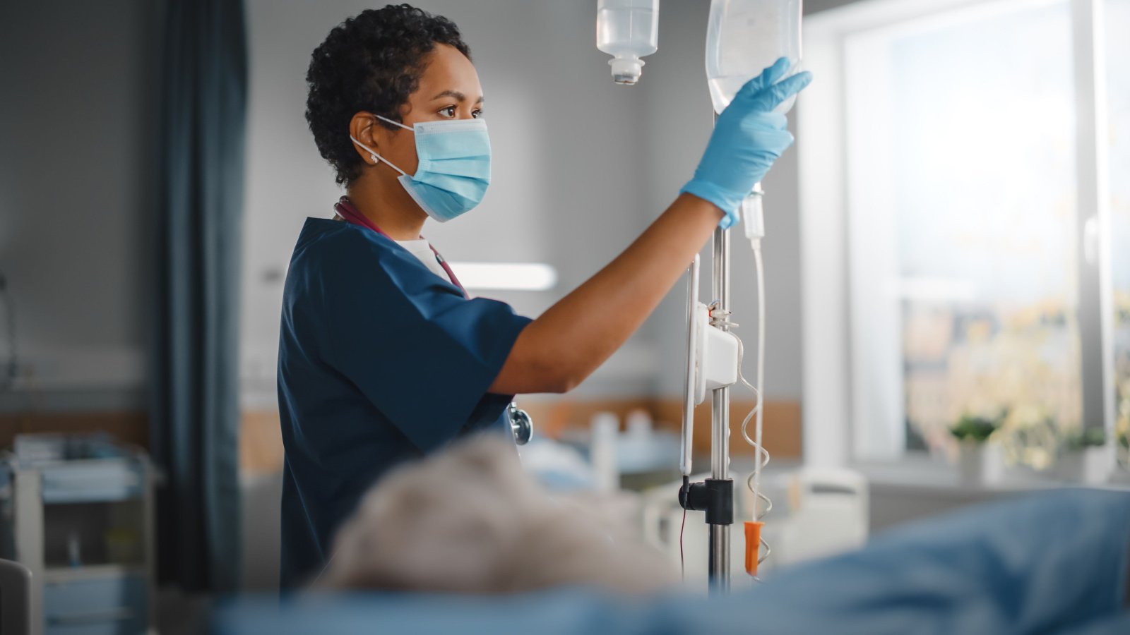 Nurse Doctor POC Woman Drips Hosptial Health Job Gorodenkoff Shutterstock