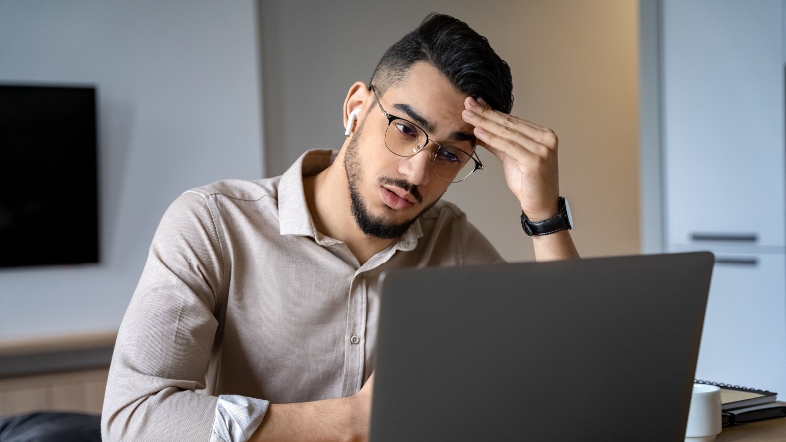 POC Male business or student laptop computer screen office thinking worried confused work Stock 4you Shutterstock