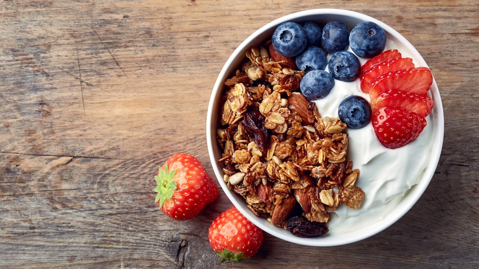 Parfait Yogurt Breakfast with Granola Blueberries and Strawberries baibaz Shutterstock