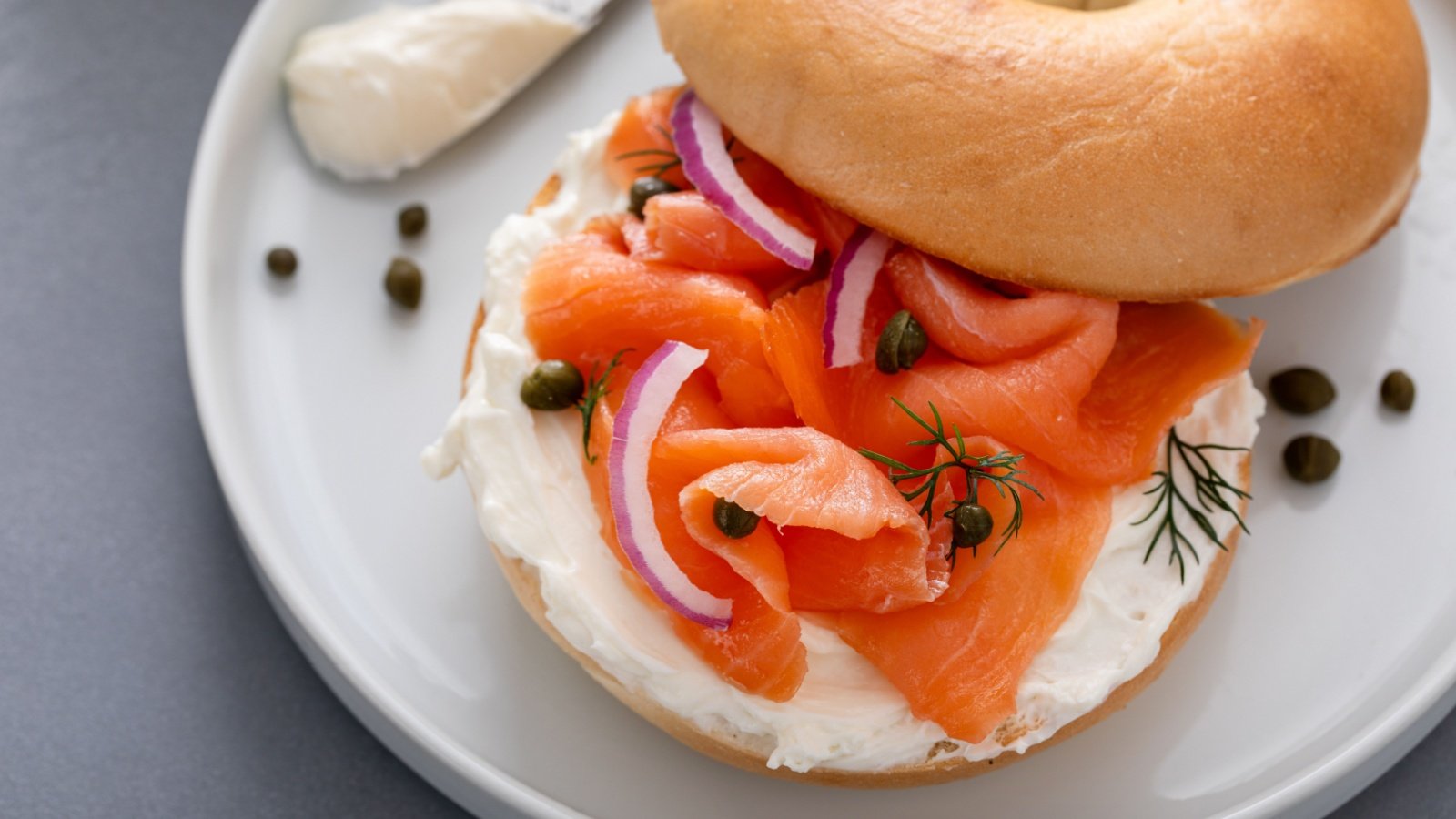 Plain bagel with salmon and cream cheese with fresh dill onions and capers for breakfast Elena Veselova Shutterstock