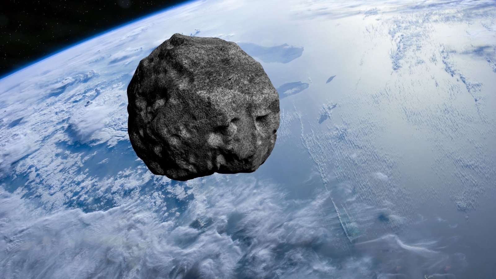 Planet Earth and big asteroid in the space buradaki Shutterstock