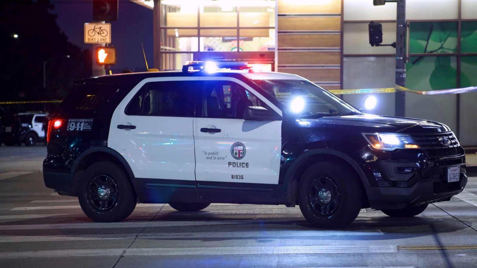 Police car blocks traffic on street Elliott Cowand Jr Shutterstock