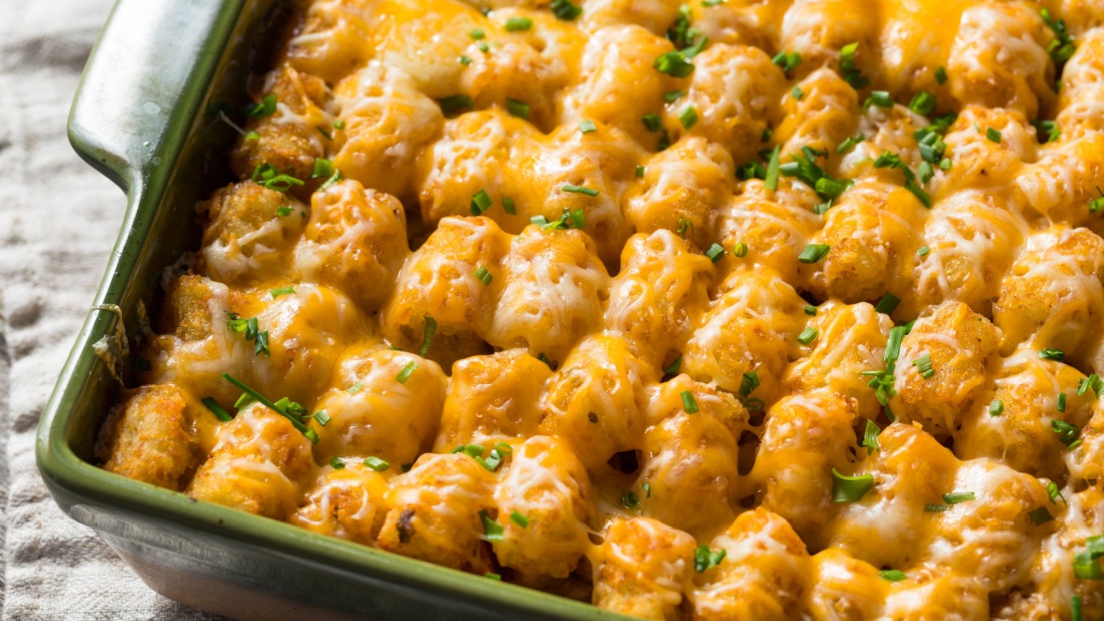 Potato Tater Tot Hotdish Casserole with Cheese fried food Brent Hofacker Shutterstock