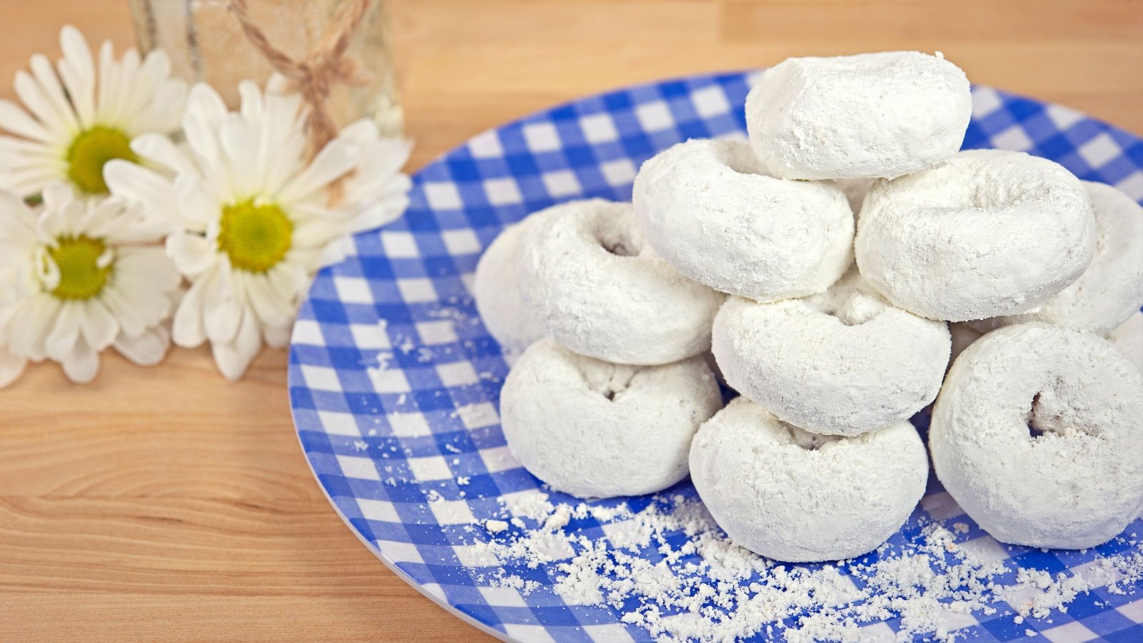 Powdered sugar donuts doughnuts breakfast sweets treats dessert food Maria Dryfhout Shutterstock