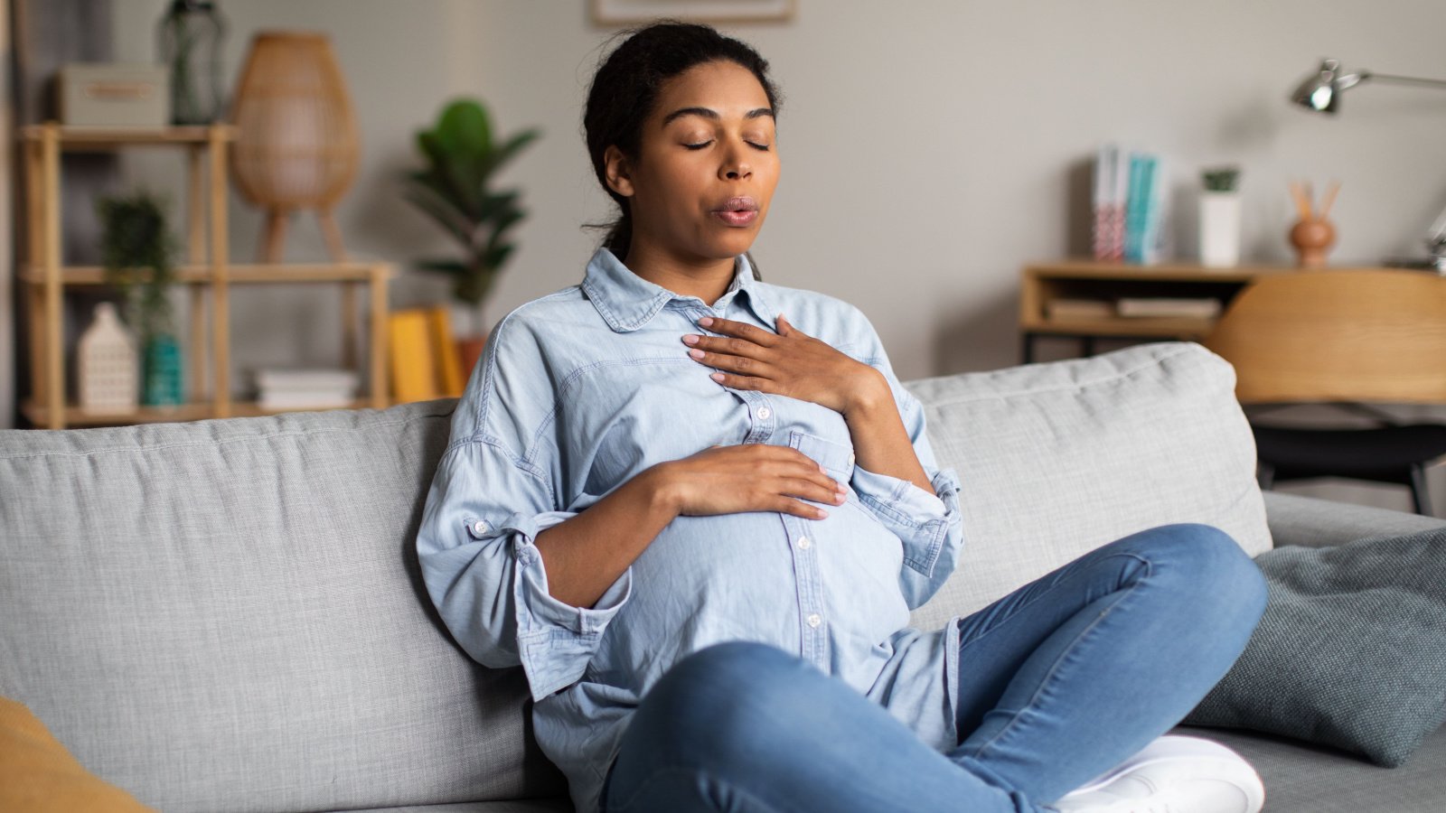 Pregnant woman POC breathing yoga meditation health Prostock studio Shutterstock