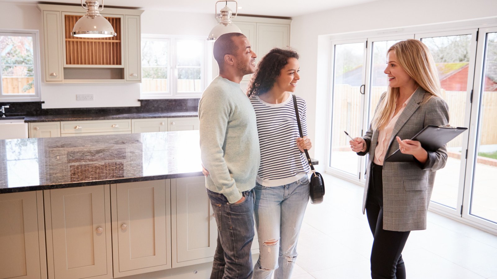 Realtor Showing Couple Monkey Business Images Shutterstock