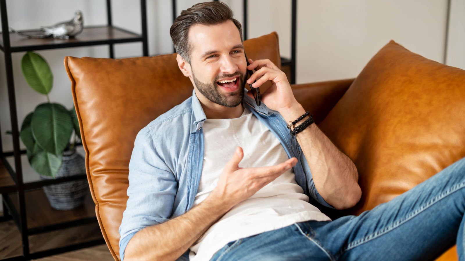 Relaxed young male bearded guy lying down on the couch in the living room vadym pastukh shutterstock