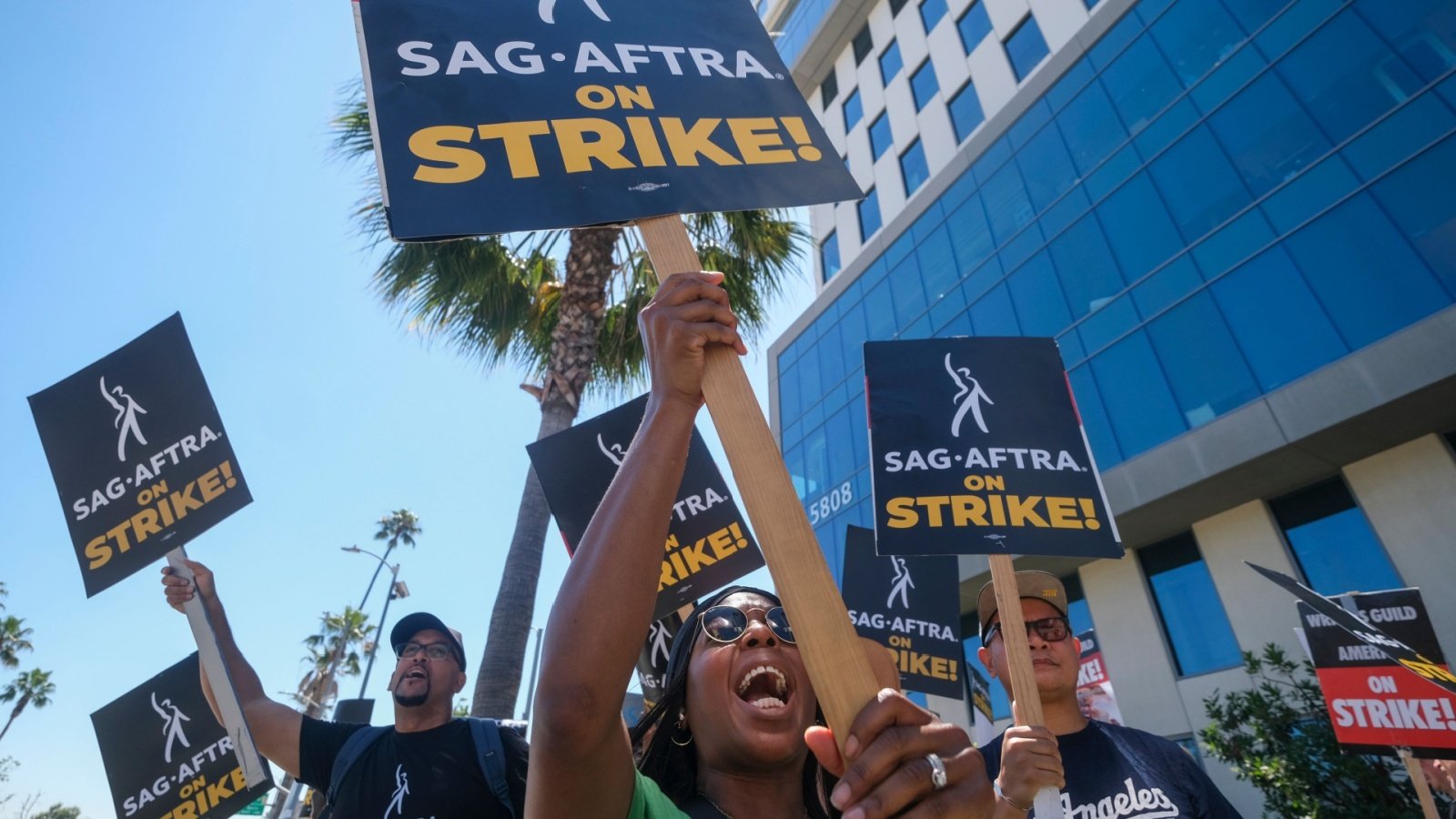 SAG AFTRA Striking writers and actors walk with pickets protest Ringo Chiu Shutterstock