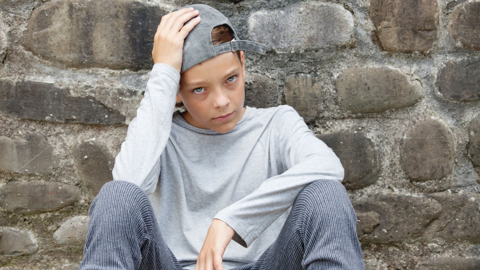 Sad boy outdoors unhappy teenager gladskikh tatiana shutterstock