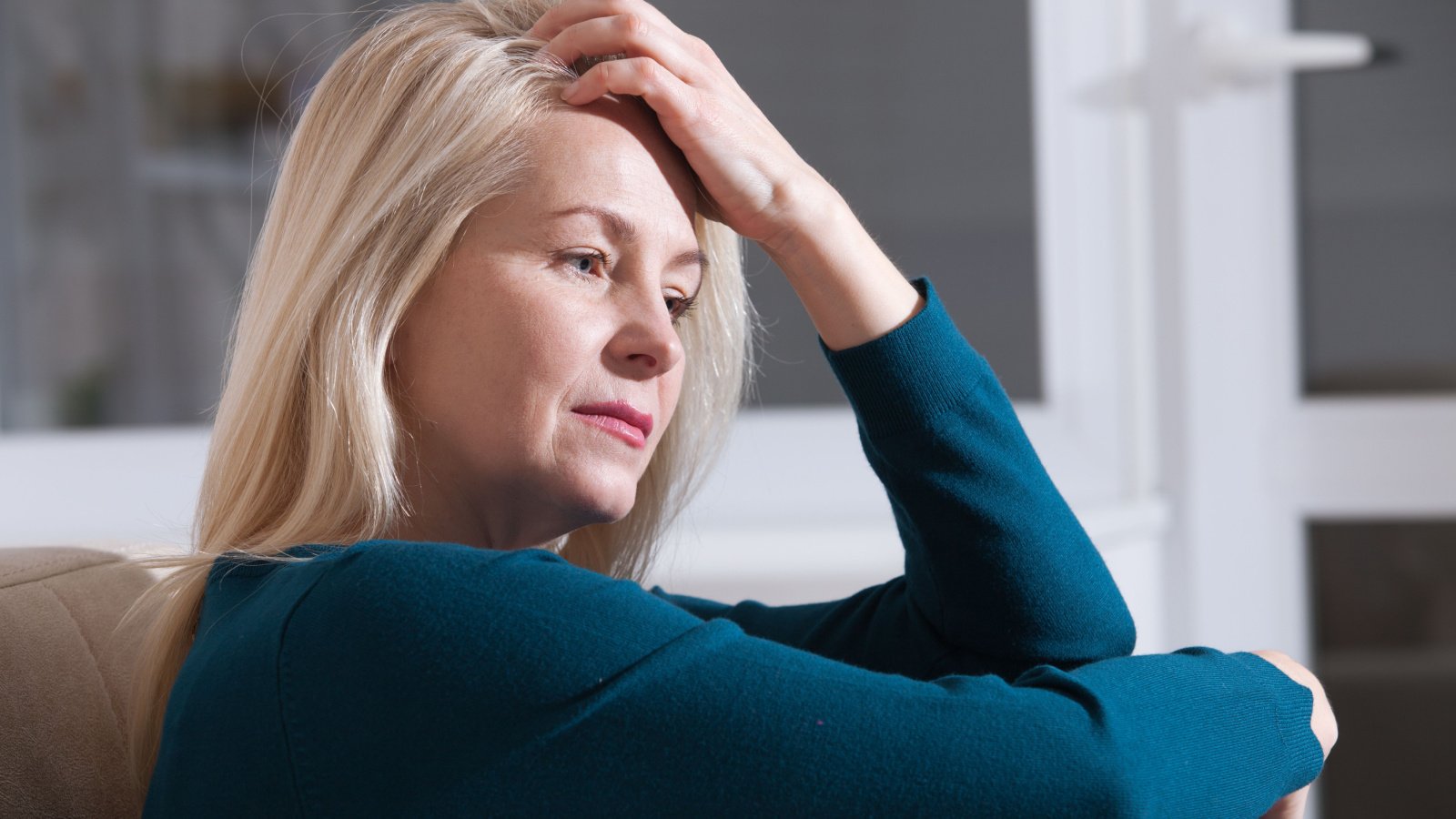 Sad depressed woman mother older senior stressed miss ty shutterstock