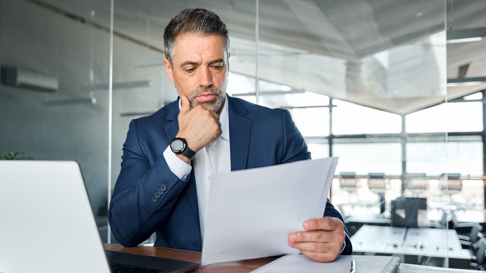 Serious business male executive reading terms work office investor insta photos Shutterstock