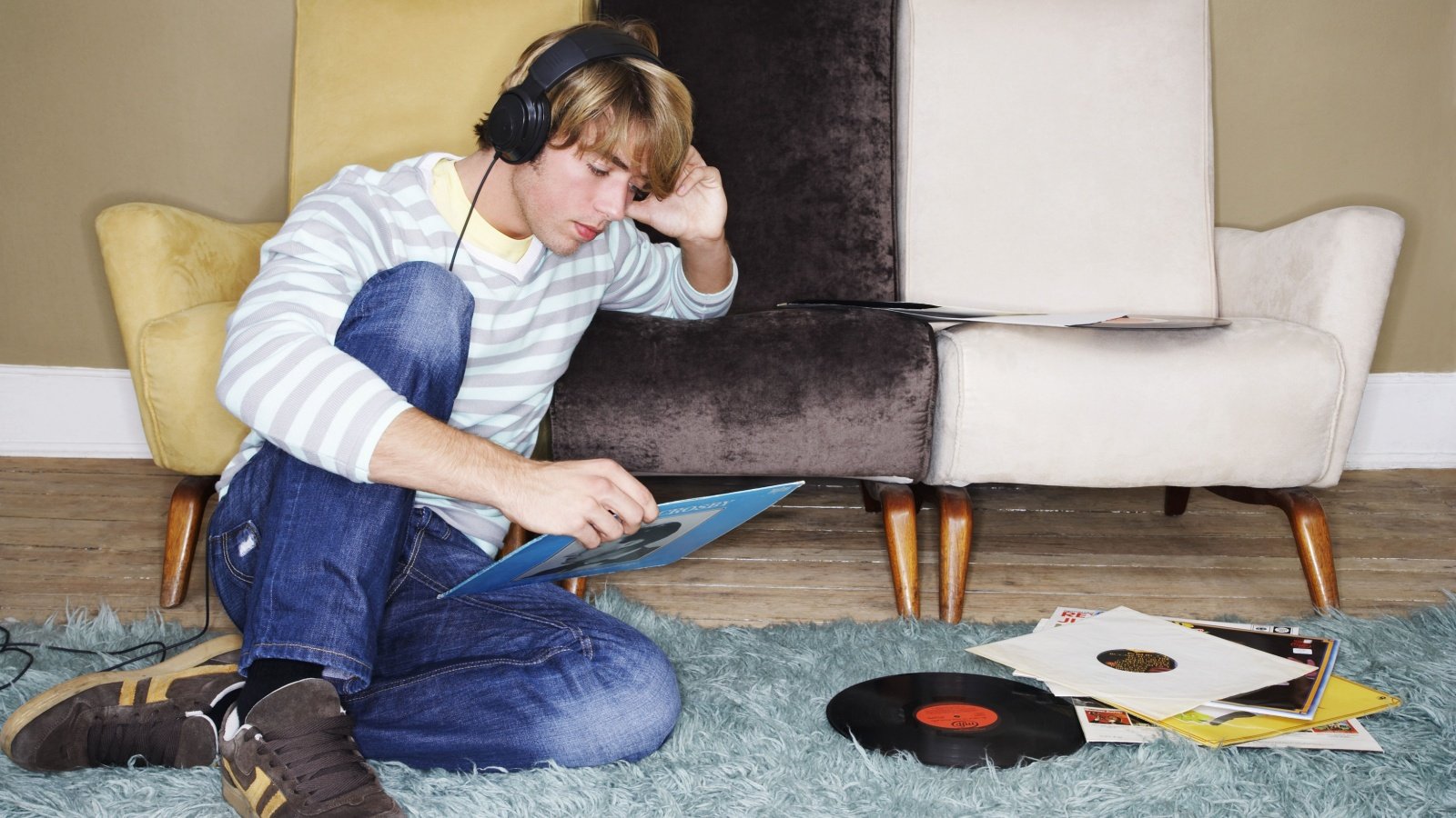 Shag Rug Listening to Vinyl Records 1970s sirtravelalot Shutterstock