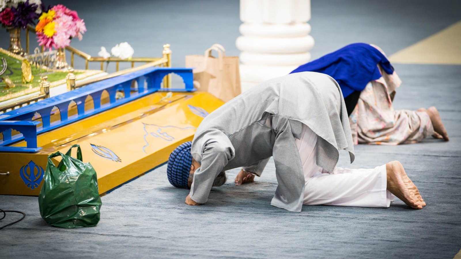 Sikh Man doing Matha Tek and Bowing To Guru Religion SabiLali Shutterstock