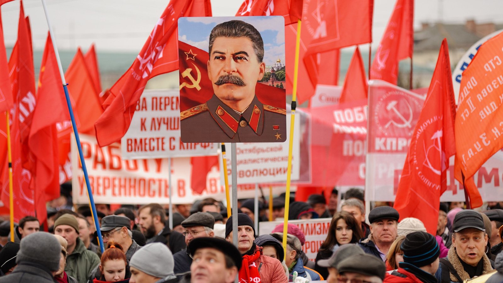 Stalin portrait and Communist flags Alexey Borodin Shutterstock Stalin portrait and Communist flags Alexey Borodin Shutterstock