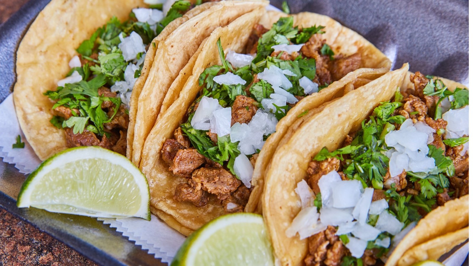 Steak tacos with onions cilantro and lime Nicholas J Klein Shutterstock