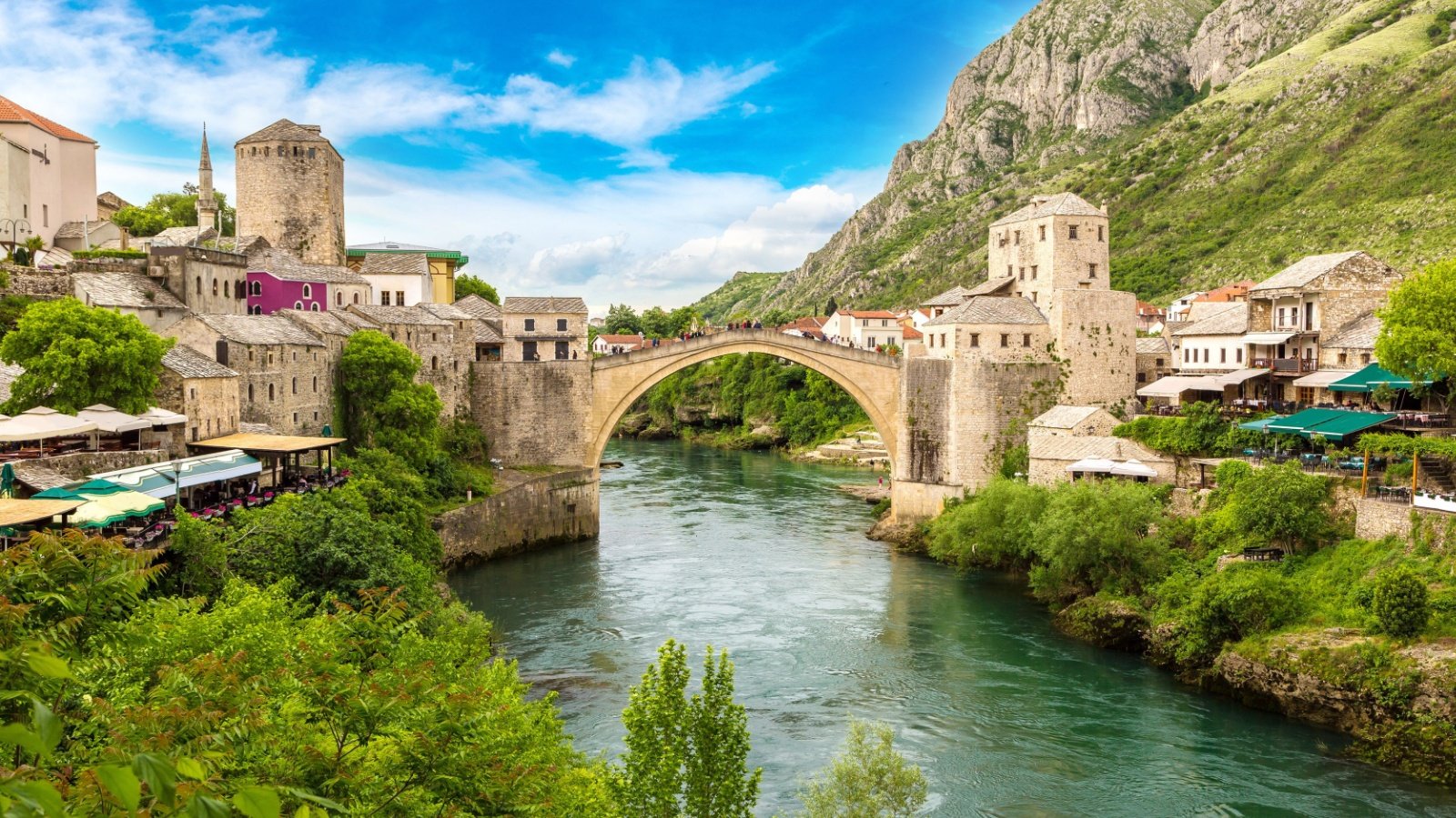 The Old Bridge in Mostar in a beautiful summer day, Bosnia and Herzegovina Sergii Figurnyi Shutterstock