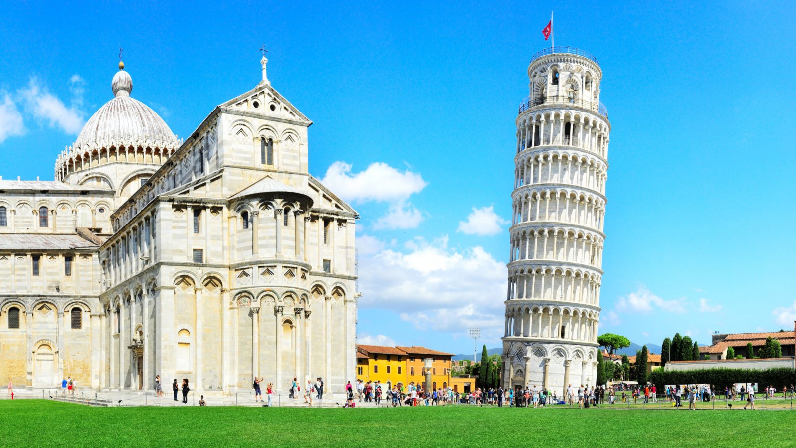 Tourist visiting the leaning tower of Pisa Italy joyfull shutterstock